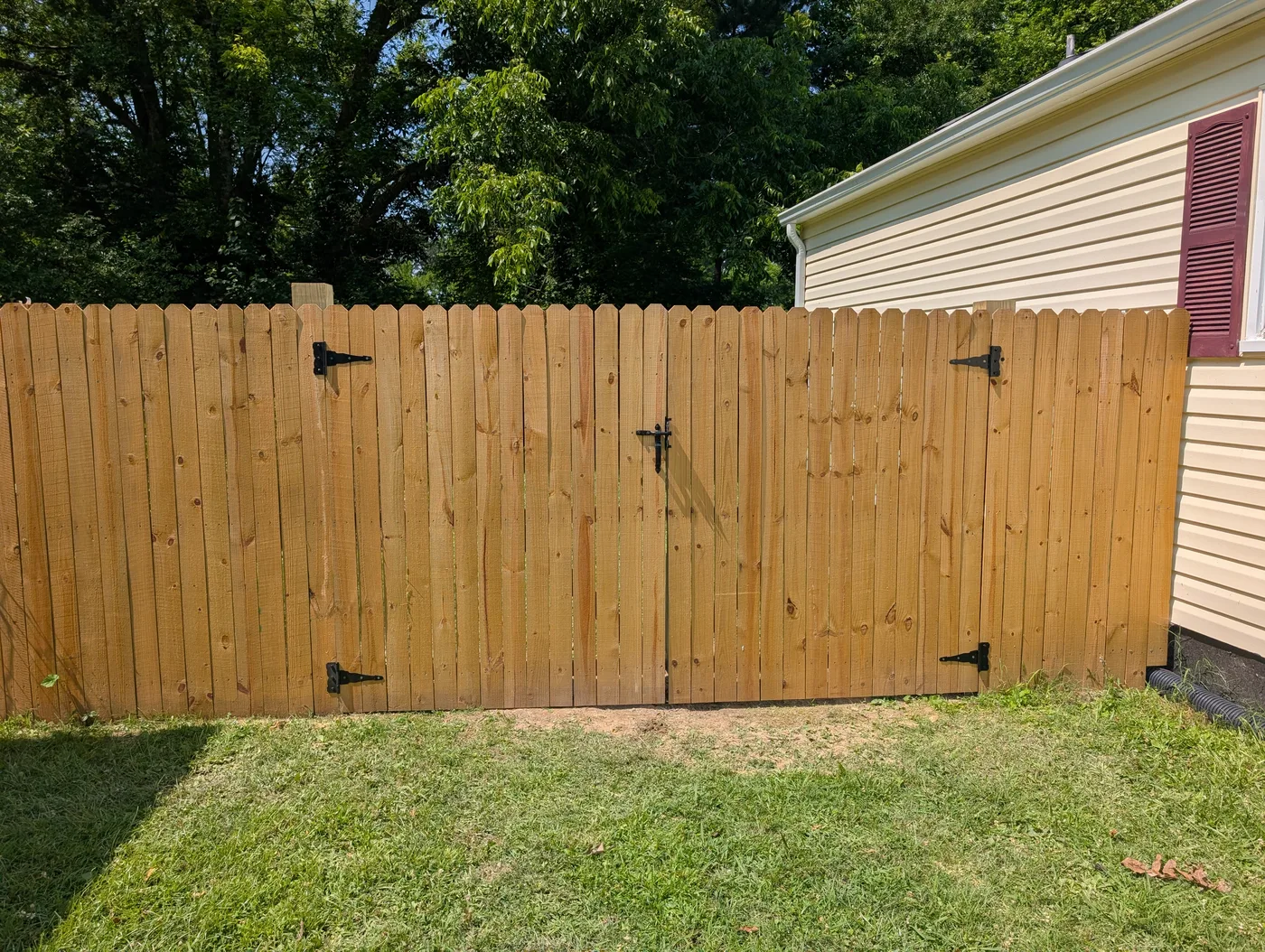 Double wooden fence gate completed by Frye Inc.