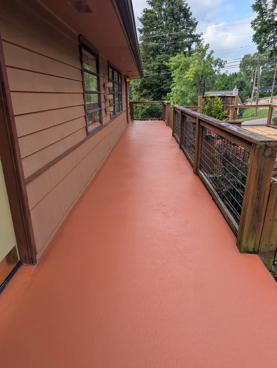 Porch floor finished in red by Frye Inc.
