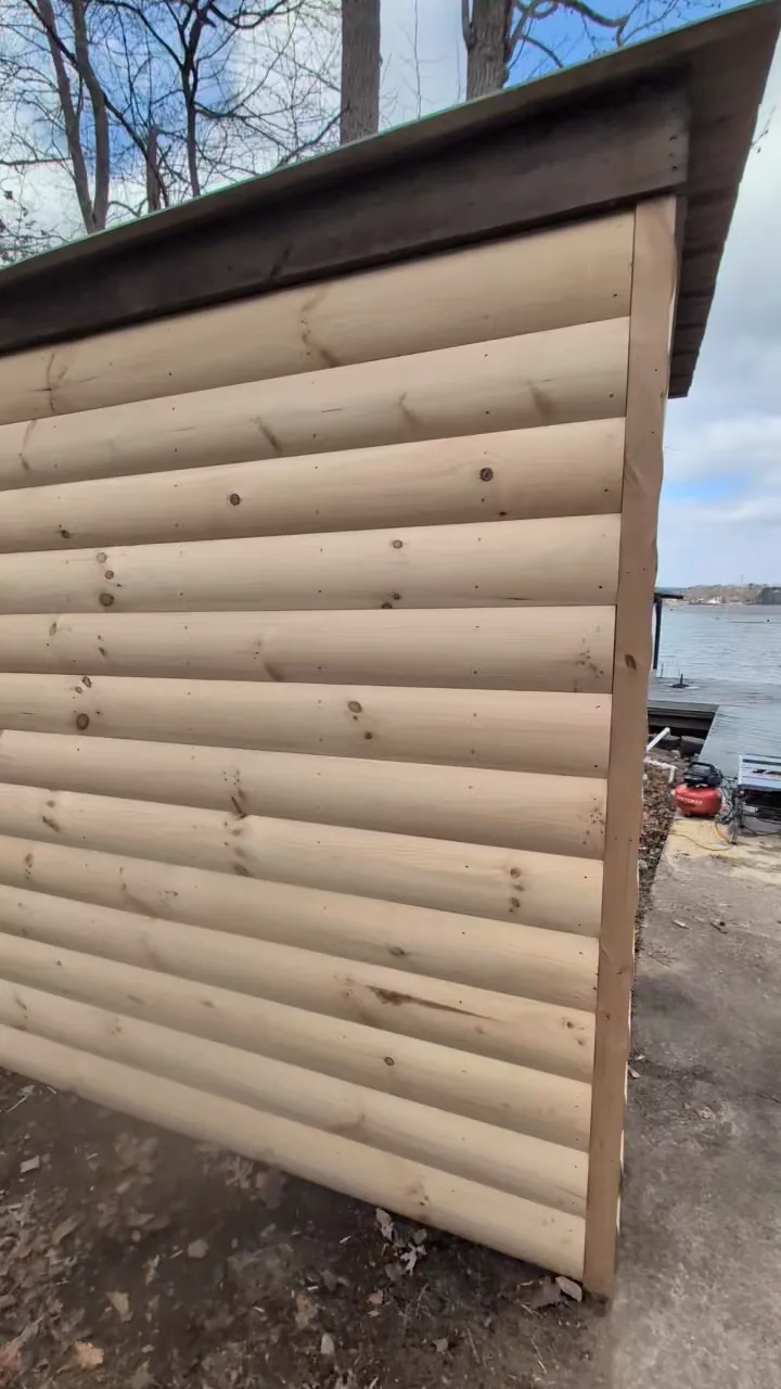 Replacement wood shed siding and door trim from a Frye Inc. maintenance project