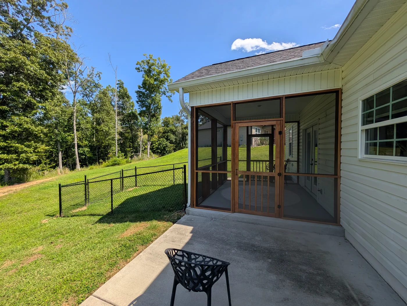 Timber-framed screened patio and screen door from a Frye Inc. project
