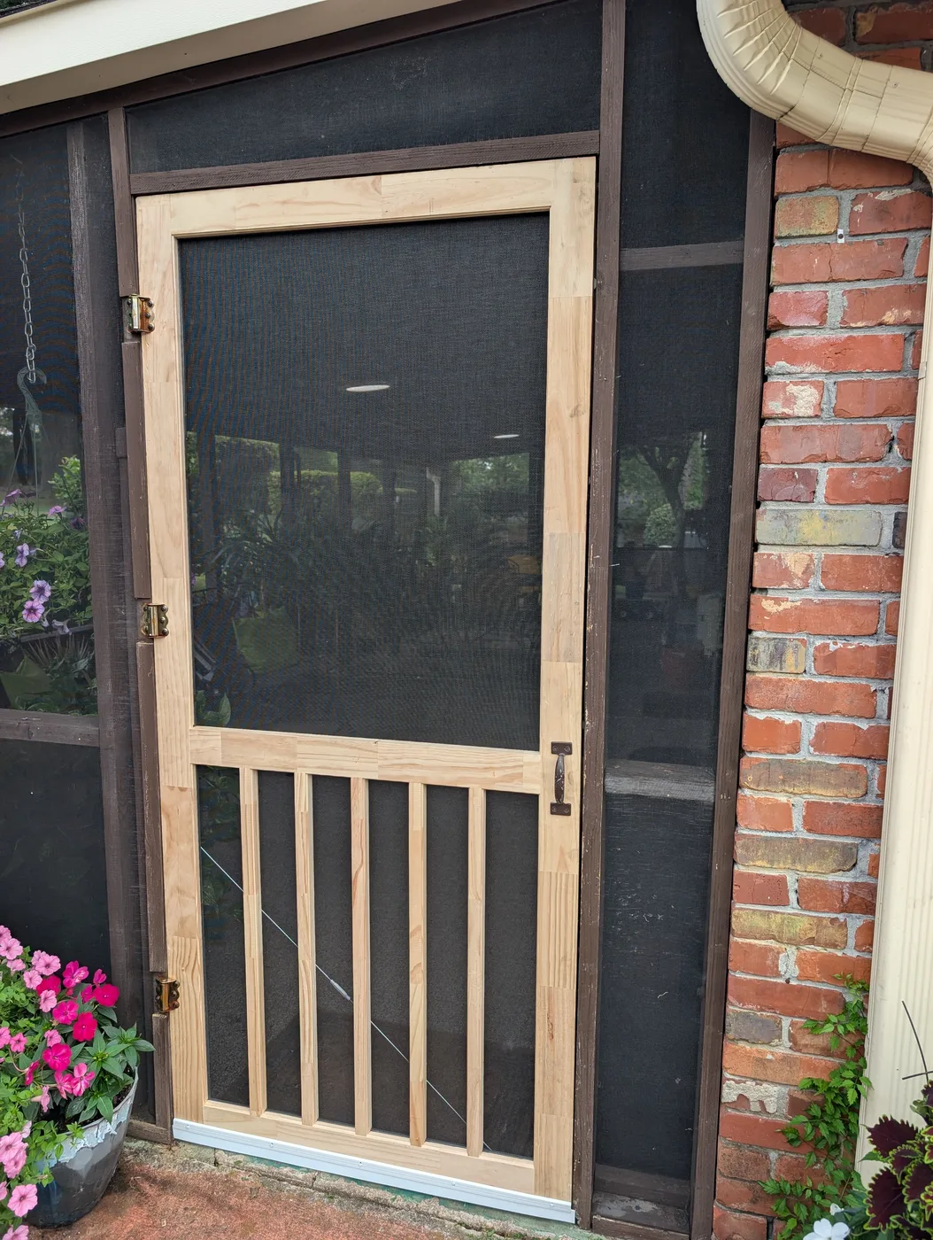 Wooden screen door installed by Frye Inc.